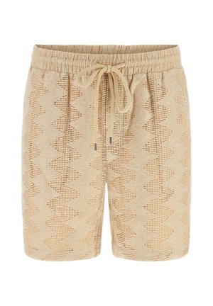 Beżowe dzianinowe szorty z otwartym wzorem w jodełkę, elastycznym pasem i sznurkiem do zawiązywania z przodu.