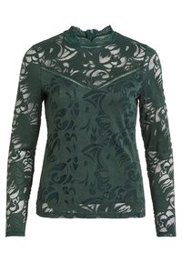 Top verde in pizzo a maniche lunghe con colletto alto, motivo floreale e finitura testurizzata. Presenta una chiusura con zip sul retro.
