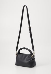 Black faux leather handbag with a braided handle, an adjustable strap, gold hardware, and a soft, structured shape.