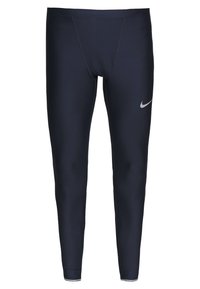 Granatowe legginsy z elastycznego materiału, z dopasowanym krojem oraz małym, srebrnym logo Nike na górnej części uda. Gładka tekstura.