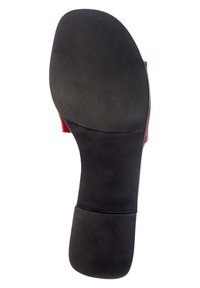 Semelle de chaussure en caoutchouc noir avec une texture lisse et une forme arrondie. Taille marquée "38". Aucun motif ou détail supplémentaire visible.