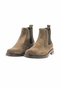 Stivali Chelsea in suede marrone con una texture liscia, pannelli laterali elastici e suola in gomma piatta. Linguetta sul tallone per un facile indossamento.