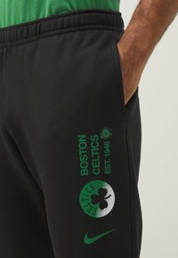 Nike Performance NBA BOSTON CELTICS JOGGERS - Tracksuit bottoms - black