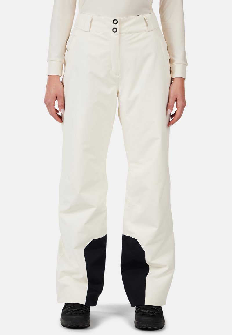 Pantaloni da sci impermeabili bianchi con accenti neri, caratterizzati da una gamba larga, due tasche frontali e chiusura con bottone in vita.