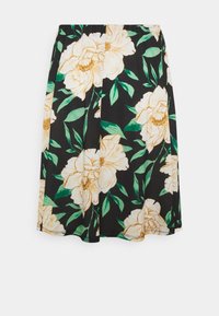 Jupe noire à motfs floraux avec de grandes pivoines crème et jaunes accompagnées de feuilles vertes. Taille élastique, longueur au genou, tissu doux au toucher.