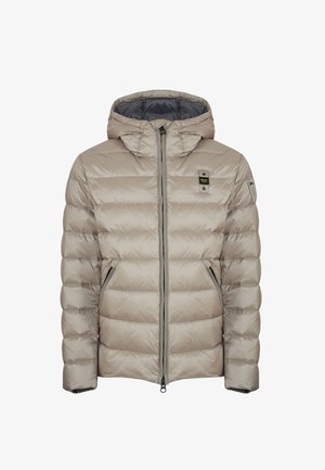 Giacca a vento trapuntata beige chiaro con cappuccio, zipper frontale, due tasche con zipper e piccoli loghi sul petto e sulla manica sinistra.