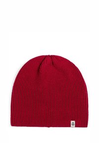 Red knitted beanie hat with a ribbed texture and a small white logo patch at the bottom right. Soft material and rounded top design.