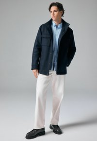 Next Jas - navy blue texture