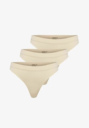 Set aus drei beigen Tanga-Unterhosen, hergestellt aus geripptem Material. Verfügt über einen niedrig geschnittenen elastischen Bund mit dem Markennamen in Schwarz bedruckt.