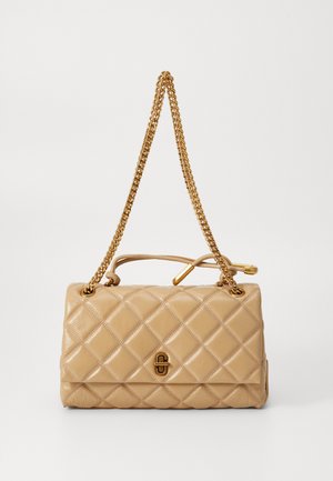 Beige quilted handbag made of leather, featuring gold chain straps and a decorative clasp on the front. Smooth texture with diamond pattern.