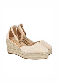 Alpargatas de cuña de ante beige con tiras en el tobillo y medias suelas de yute trenzado, con punta cerrada y cierre de hebilla.