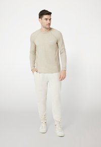 Guess Ilgarankovis viršutinės dalies drabužis - beige