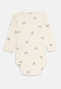 Body per neonato di colore crema con maniche lunghe, decorato con piccole pecore grigie stampate su tutta la superficie.