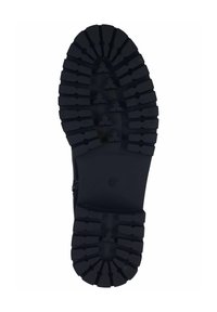 Suela de bota de goma con profundas ranuras de tracción y un diseño de banda de rodadura resistente. Color negro con un lado inferior sólido y suave para mayor estabilidad.