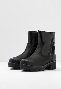 Tamaris Botines con plataforma - black