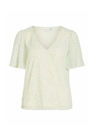 Blouse vert clair à manches courtes avec un motif subtil de petits points, col en V et manches légèrement bouffantes, conçue pour un usage décontracté ou professionnel.