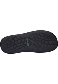 Semelle de chaussure en caoutchouc noir avec un motif texturé, comprenant un détail de logo rectangulaire et un bord lisse. Conçue pour l'adhérence et la durabilité.