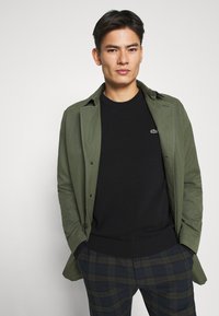 Lacoste Neule - black