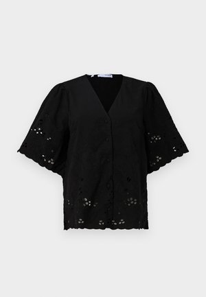 Svart kortermet bluse med V-hals, med blomsterbroderi og utskjærte detaljer. Myk stoff med teksturert overflate.