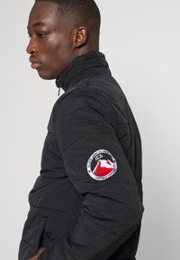 Ellesse PADDED JACKET - Vinterjakker - black