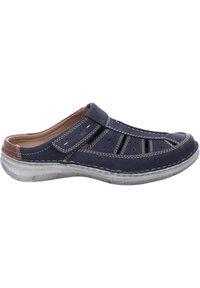 Navy leather slip-on shoe with open design, textured gray sole, white stitching accents, and cut-out vents for breathability.