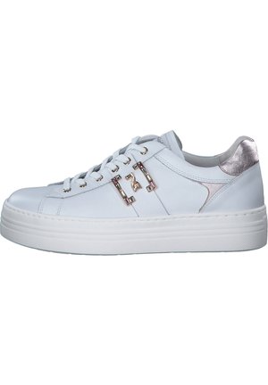 White leather sneaker with metallic silver accent on the heel, round toe, thick white sole, and decorative hardware on the side.