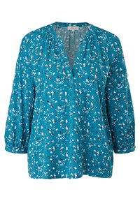 Blouse bleu sarcelle avec motif floral blanc et beige, manches trois-quarts, encolure ronde froncée et ouverture fendue en V à l'avant.