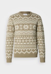 Maglione lavorato a maglia in beige sabbia con motivi geometrici e floreali bianchi. Presenta un collo rotondo e polsini e orlo a coste.