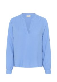 Blouse bleu clair à manches longues avec un col en V, en tissu texturé et avec des manches à poignets. Présente un motif subtil et une coupe ample.