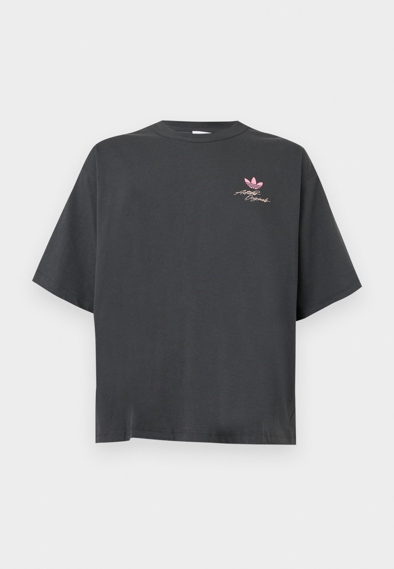Charcoal gray oversized T-shirt with short sleeves, crew neck, and small pink Adidas logo and signature on the upper left chest.