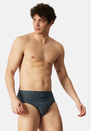 Costume da bagno da uomo in blu navy con strisce verticali verdi e gialle. Presenta un design aderente e una cintura elastica per il massimo comfort.