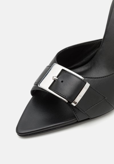Black leather high-heeled sandal featuring a pointed toe, wide strap with silver buckle accent, and smooth texture.