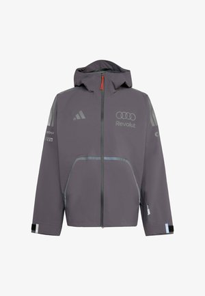 Veste imperméable grise avec capuche, dotée d'accents réfléchissants, fermeture éclair, et logos sur la poitrine et les manches. Manches avec velcro incluses.