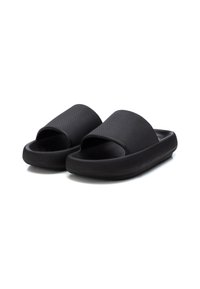 Infradito neri con parte superiore testurizzata, design open toe e una suola spessa e imbottita per il massimo comfort. La superficie presenta un motivo a righe.