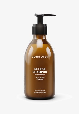 Braune Pumpflasche des Junglück Pflege Repair Shampoos mit Phyto-Keratin und Hyaluron für trockenes und gestresstes Haar.