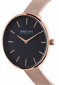 Runde schwarze Zifferblatt-Uhr mit Roségold-Mesh-Armband. Verfügt über minimalistische Stundenmarkierungen und Zeiger, klares Glas, Logo bei 12 Uhr.