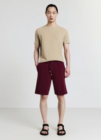 Calliope GINNICO - Pantalon de survêtement - bordeaux