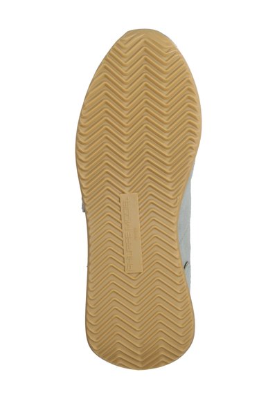 Shoe sole with a textured rubber bottom and zigzag pattern, featuring a light gray and beige color scheme and embossed logo.