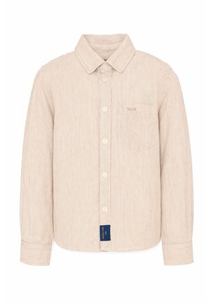 Beżowa koszula sztruksowa na guziki z długimi rękawami, zaostrzonym kołnierzykiem, kieszenią na piersi z małym haftowanym zwierzęciem oraz metką marki u dołu.