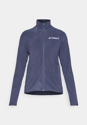 Casaco de fleece azul-marinho com gola alta, fecho de correr completo e logótipo no peito. Apresenta mangas compridas e bolsos laterais. Material macio e texturizado.