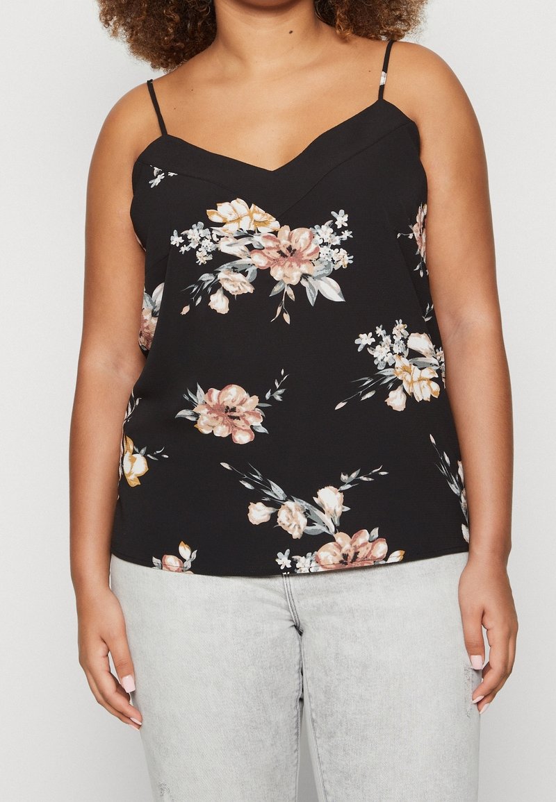 Svart ärmlös topp med V-hals, med ett blommigt mönster i mjuk rosa, krämfärgad och grön. Lättviktig tyg, justerbara band.