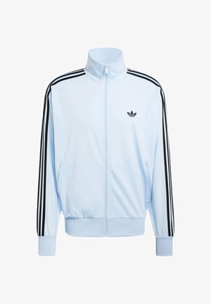 Vaaleansininen vetoketjullinen verkkatakki, jossa mustat Adidaksen kolme raitaa hihoissa ja musta trefoil-logo vasemmassa rinnassa.