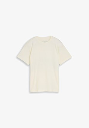 Jednostavna kratkih rukava majica s okruglim izrezom u nijansi prašnjavo bijele boje, položena ravno s vidljivom oznakom marke unutar ovratnika.