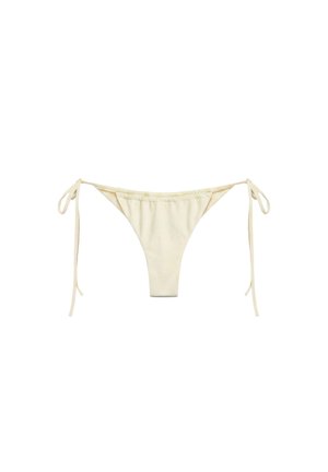Partea de jos a costumului de baie în culoare crem, cu legături laterale, realizată din material neted, afișată pe un fundal alb.