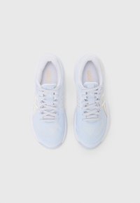 Light blue athletic sneakers with mesh upper, white laces, gold accents, and a cushioned sole. Rounded toe and textured detailing throughout.
