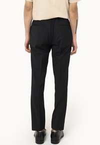 Drudd Italia D-GOLDES - Trousers - black
