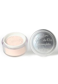 Translucent jar containing pale pink loose powder, with a silver lid embossed with “Poudre de Riz Dermophile” in decorative script.