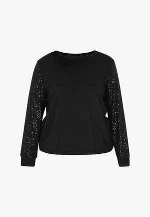 Fekete, hosszú ujjú felső, puha testrésszel és csillogó, flitterezett ujjakkal. Kerek nyakkivágással és szűk mandzsettákkal rendelkezik.