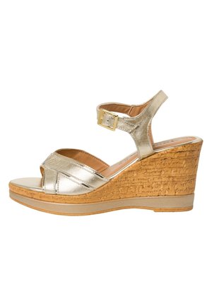 Gold metallic wedge sandal with cork-textured midsole, ankle strap with buckle, open toe design, and smooth leather-like upper.