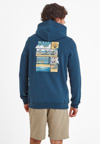 Navy blue hooded sweatshirt with graphic design on back featuring beach scenes and shells, made of cotton blend fabric, standard fit.